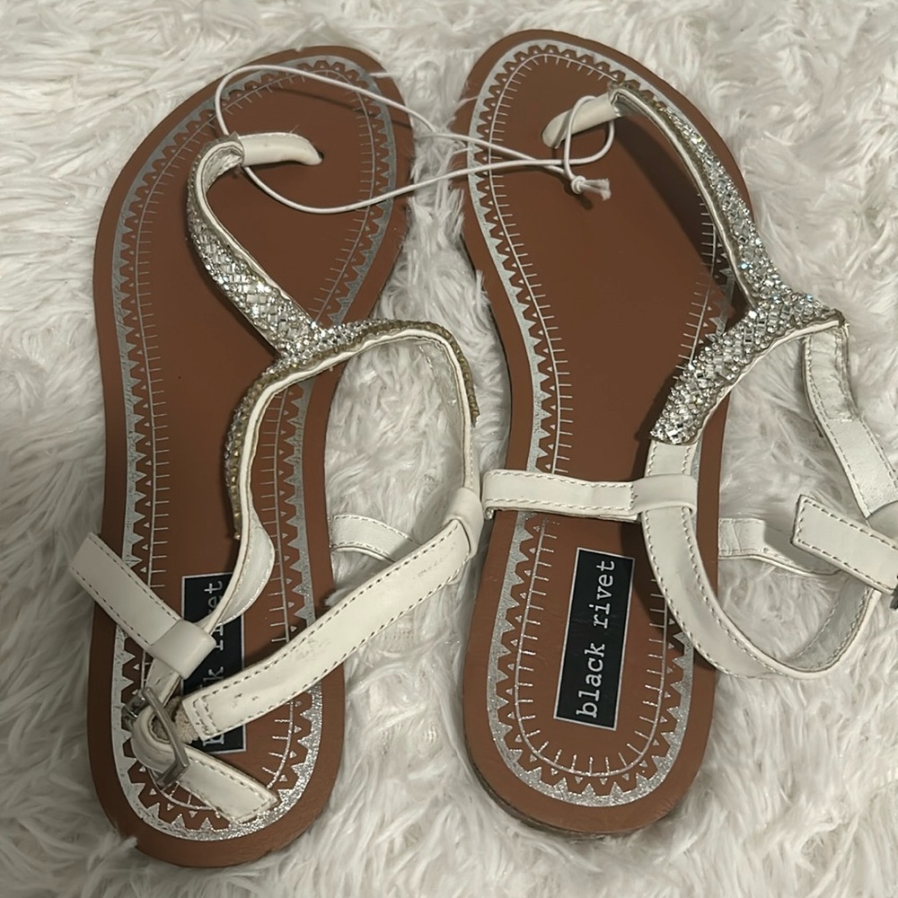 Brand new never wear Black rivet sandals with nice shiny  in the straps size 8.5